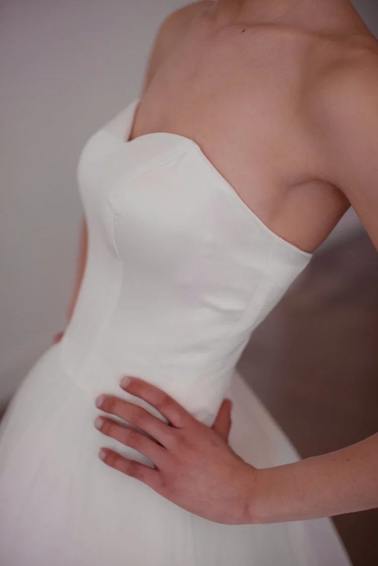 Lyra gown simple modern wedding gown with strapless sweetheart neckline and fitted bodice and ballgown skirt