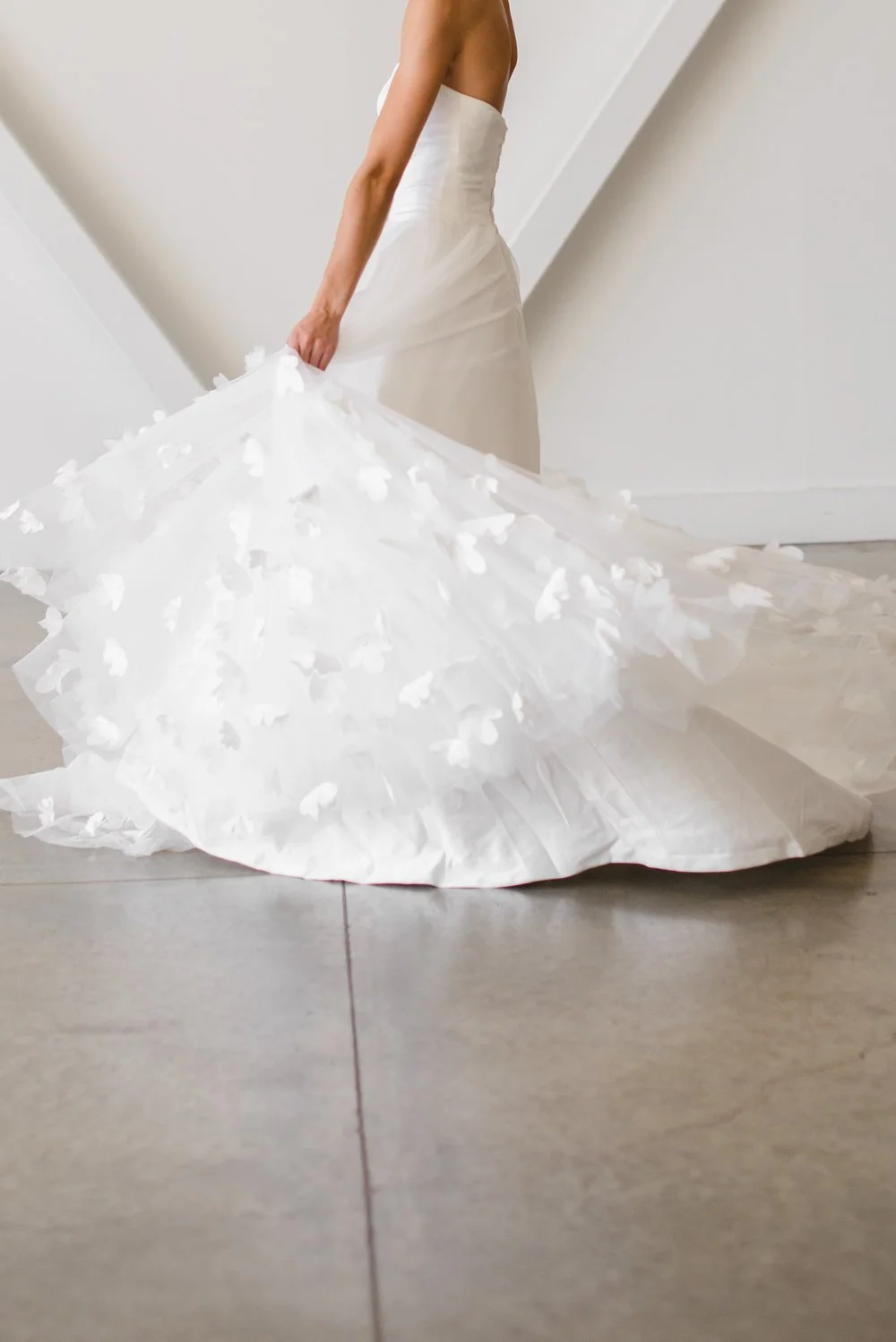 Lyra gown simple modern wedding gown with 3d floral applique and clean white ballgown slip