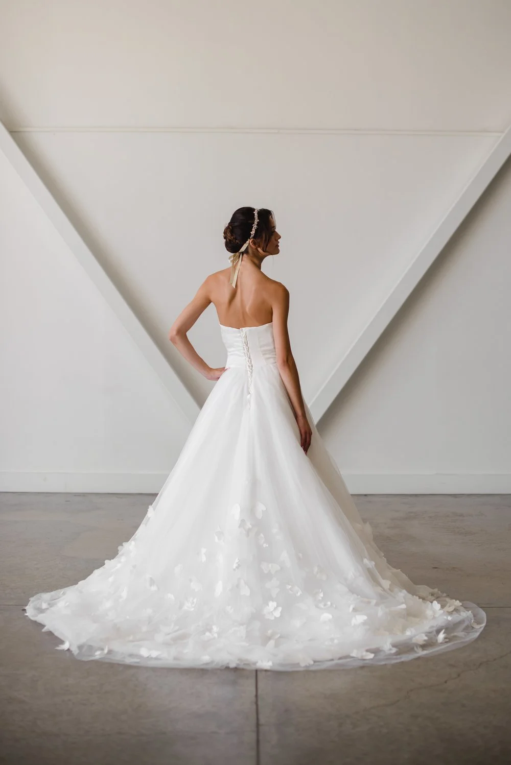 Lyra gown simple wedding dress with strapless sweetheart neckline and 3d floral applique details