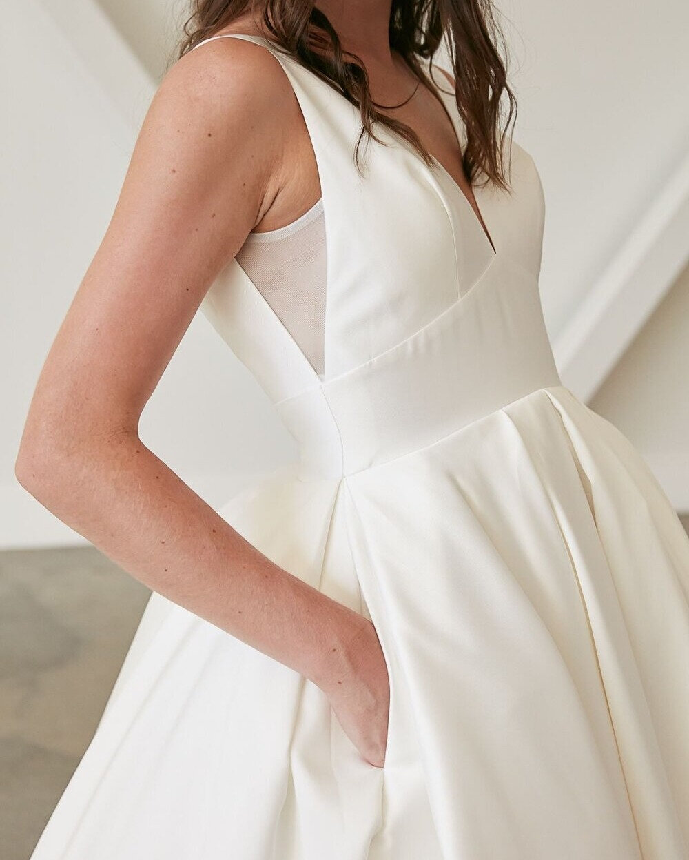 Pockets &ndash; a gown detail almost any bride would be on board with. Yes, even a royal ballgown silhouette like this one can be practical too! Our Lulu gown with its pleated, duchess satin skirt and mesh side panels is the perfect option for a brid