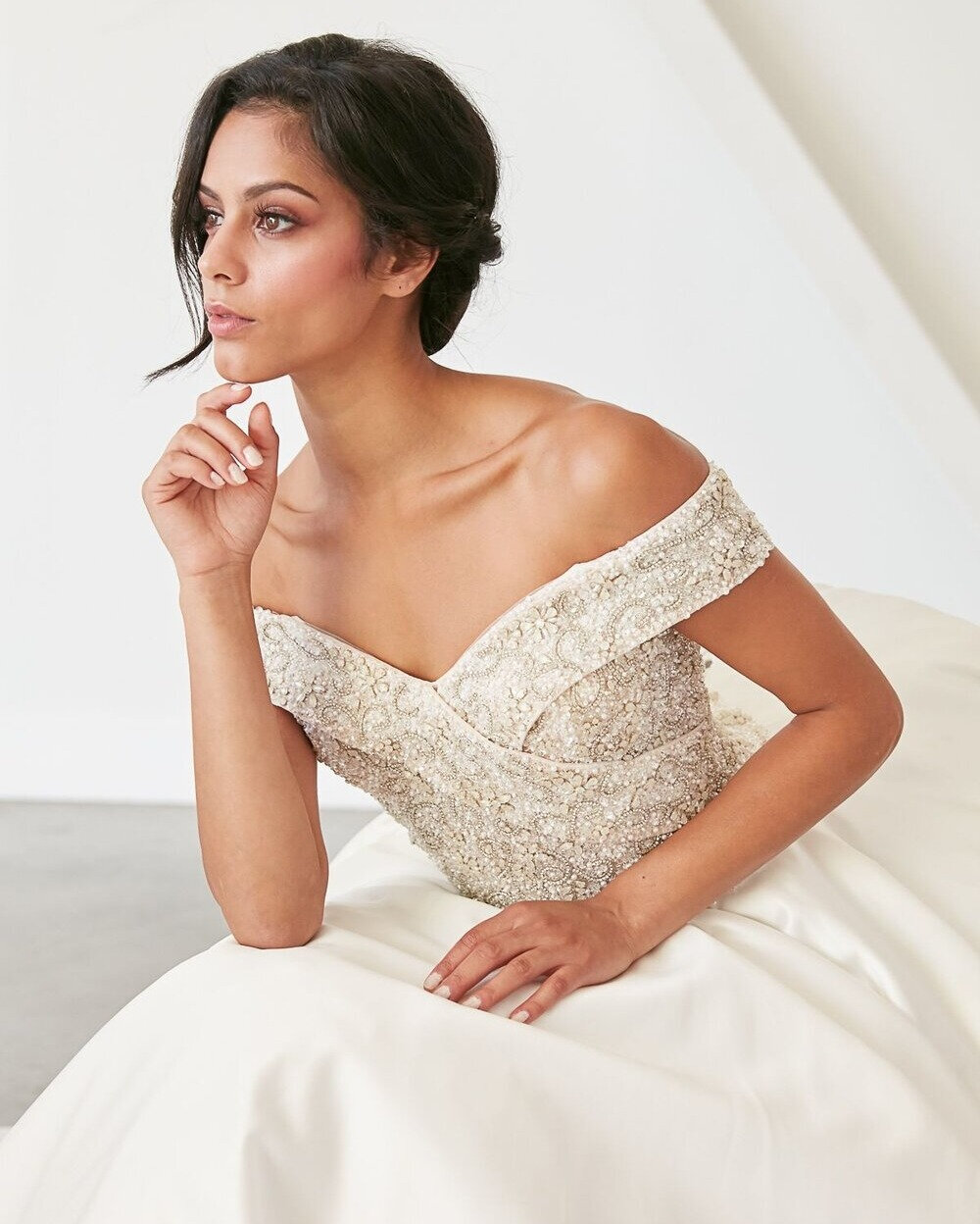 With a cathedral train and a crystal beaded bodice, you can&rsquo;t help but have a head-turning grand entrance with our Diana gown! If you&rsquo;re looking for a chic, lux bridal style a la Ivy Getty and her infamous mirror wedding dress - this gown