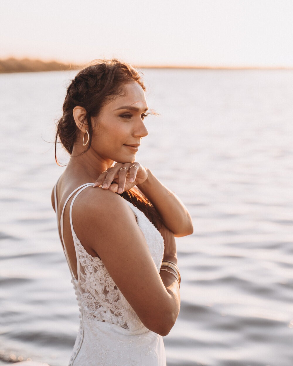 Spring has officially started and you know what that means &ndash; beach weddings! Chasing the sun, in this styled shoot, we captured a literal wedding glow. The gold jewelry and bronze-tinted makeup created a boho-chic bridal look that is elegantly 