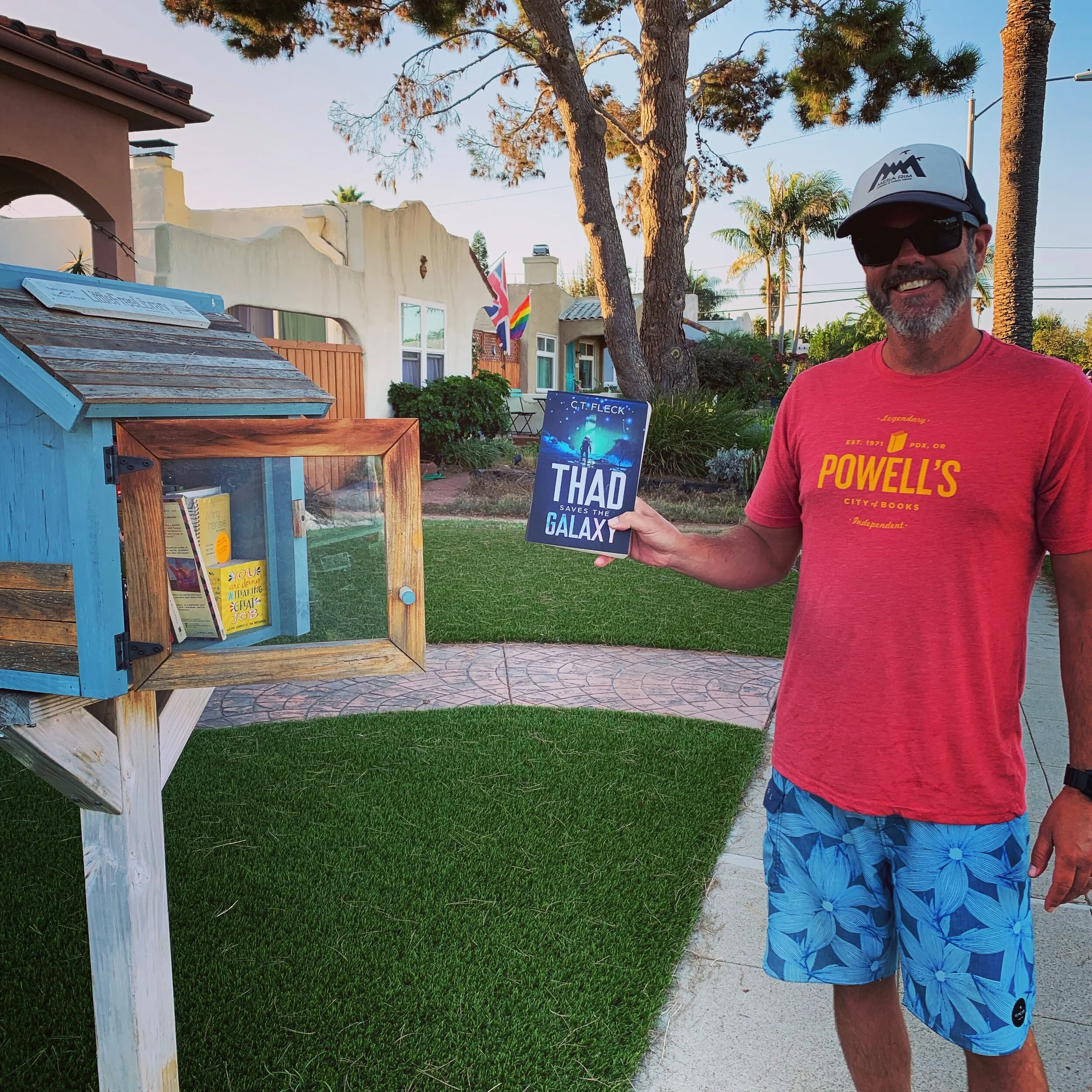 Thad Saves the Galaxy going in to a free little library.