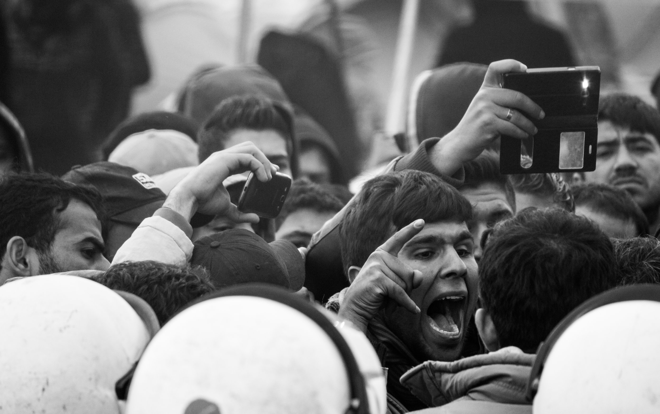 A man shouts at a police line during a protest in the camp of Idomeni, Greece in March 2016. Throughout March and April regular protests became more frequent as people became more frustrated.