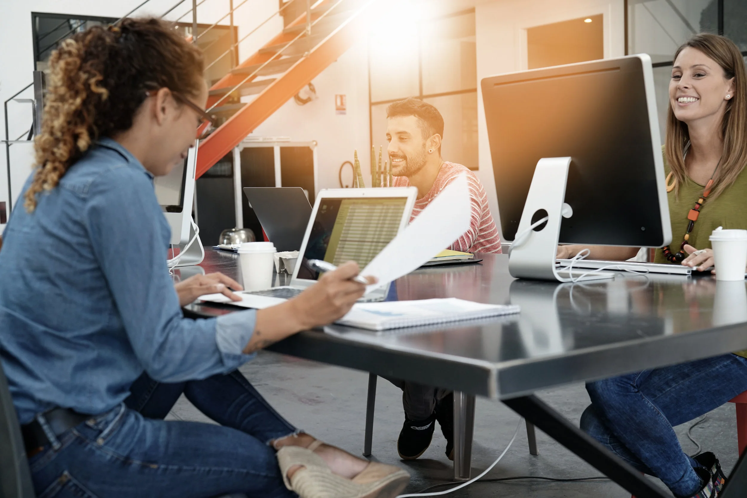 AdobeStock_163911581. Young workers at computers.jpeg