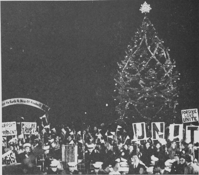 Banners supporting President Nixon wave beneath the National Christmas Tree