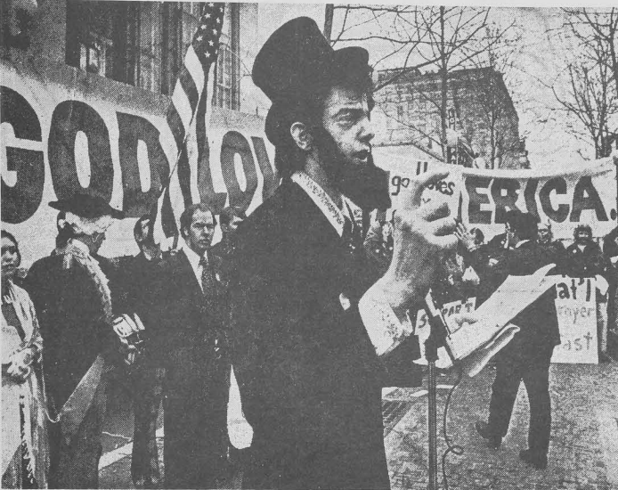 A member portraying Abraham Lincoln speaks at a NPFWC rally