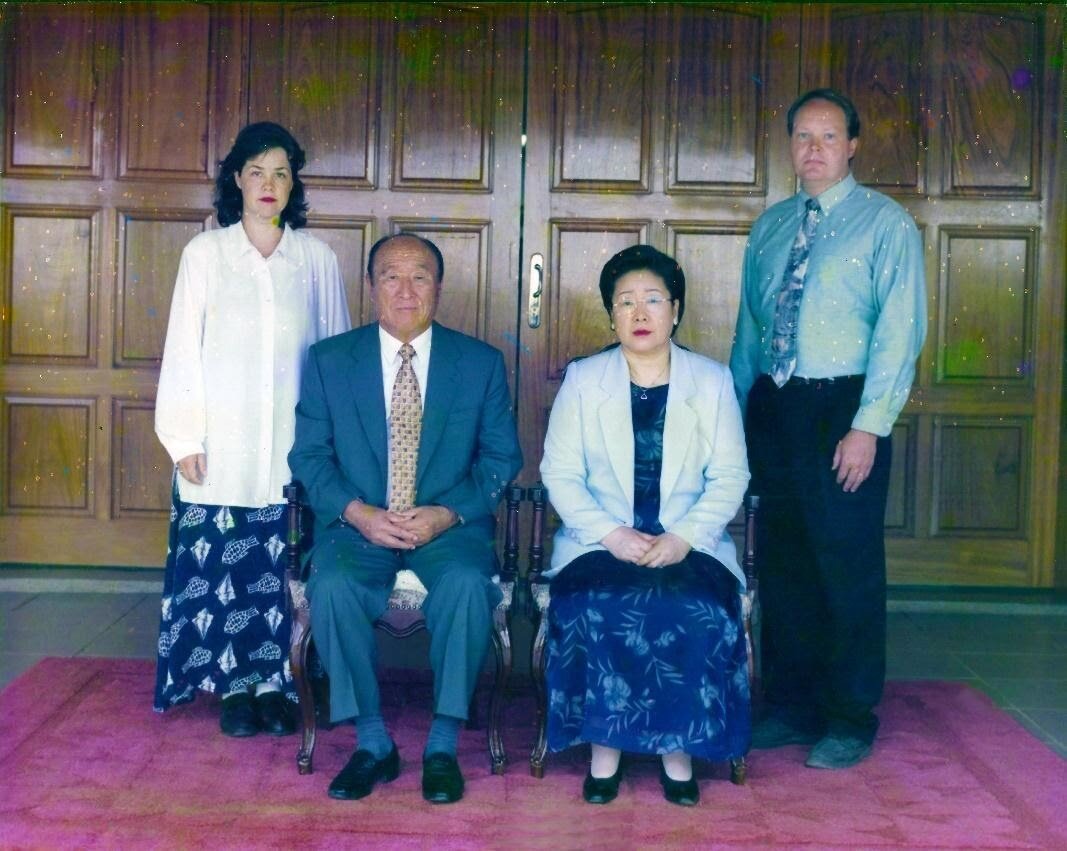 Portrait with True Parents in Jardin, Brazil, December 1999. Young Jin Nim had recently passed away.