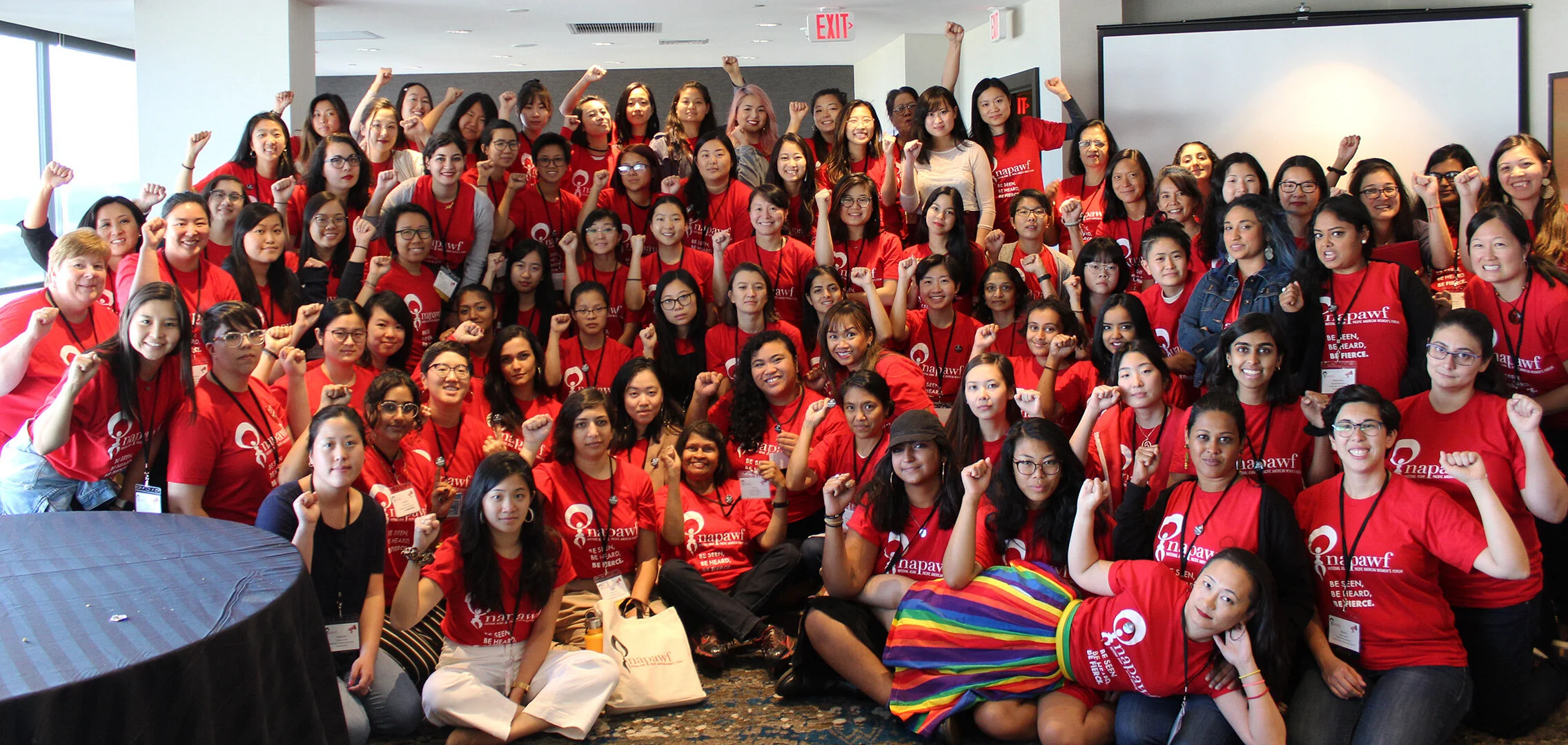 NAPAWF members pose fro a group photo at our 2019 Power Up Conference. Everyone is wearing matching shirts.