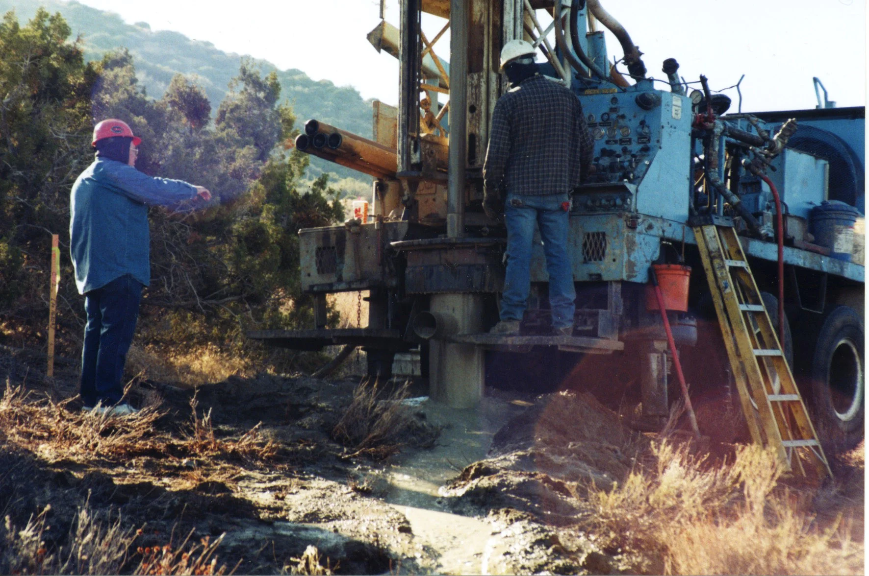 The drilling rig forces mud down through the stem to the drill bit which lubricates the bit and keeps it cool, and as it drills, the mud is forced up and out of the hole carrying with it the cuttings. What you see here is the mud carrying the cuttings flowing up and out from the bottom of the hole.