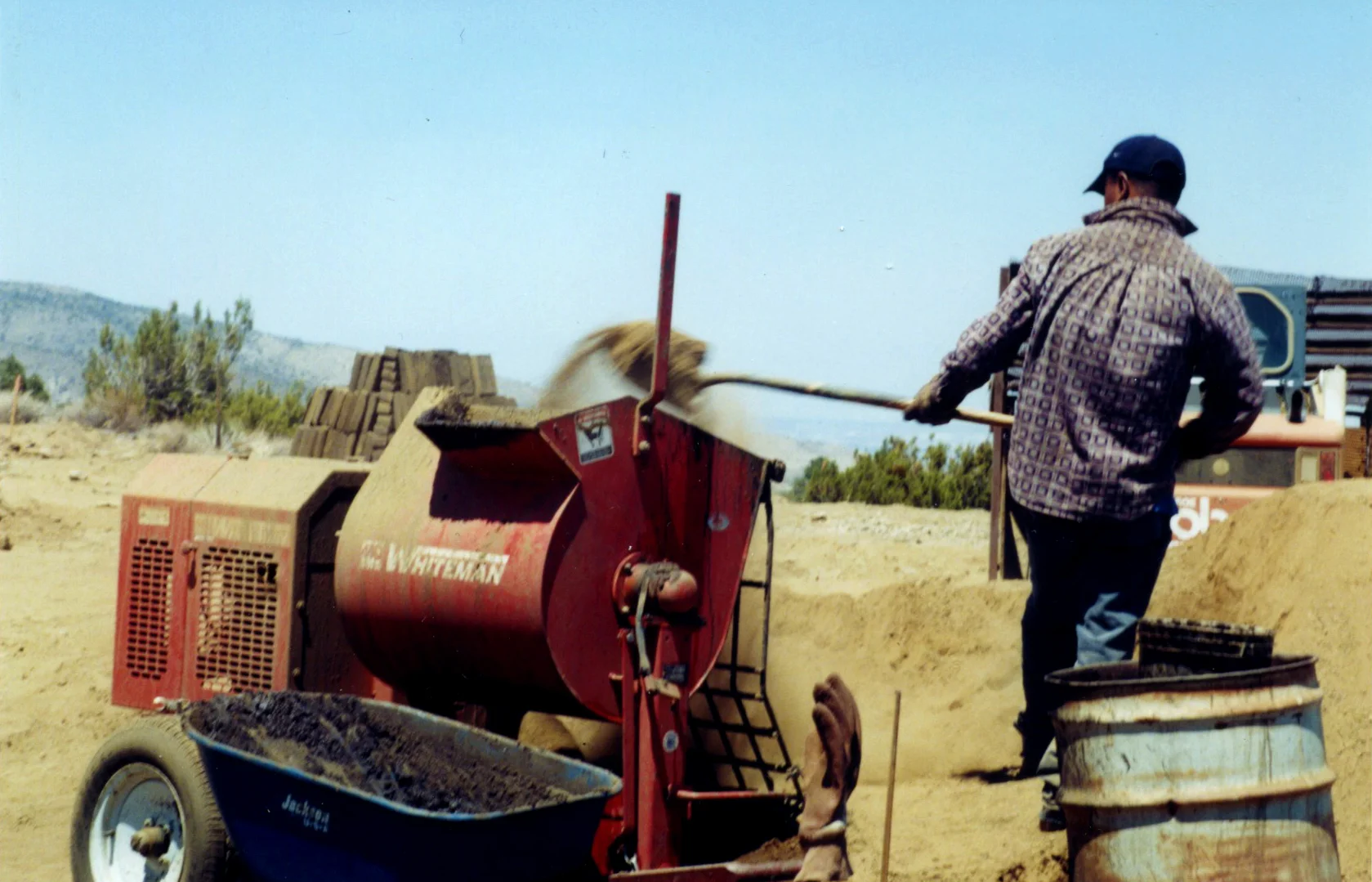Into the mortar mixer, 40 shovels of clean dirt…
