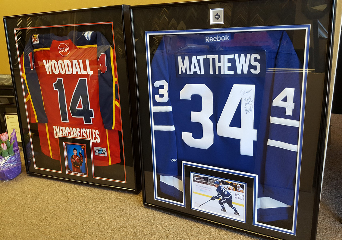 pinning a jersey in a shadow box