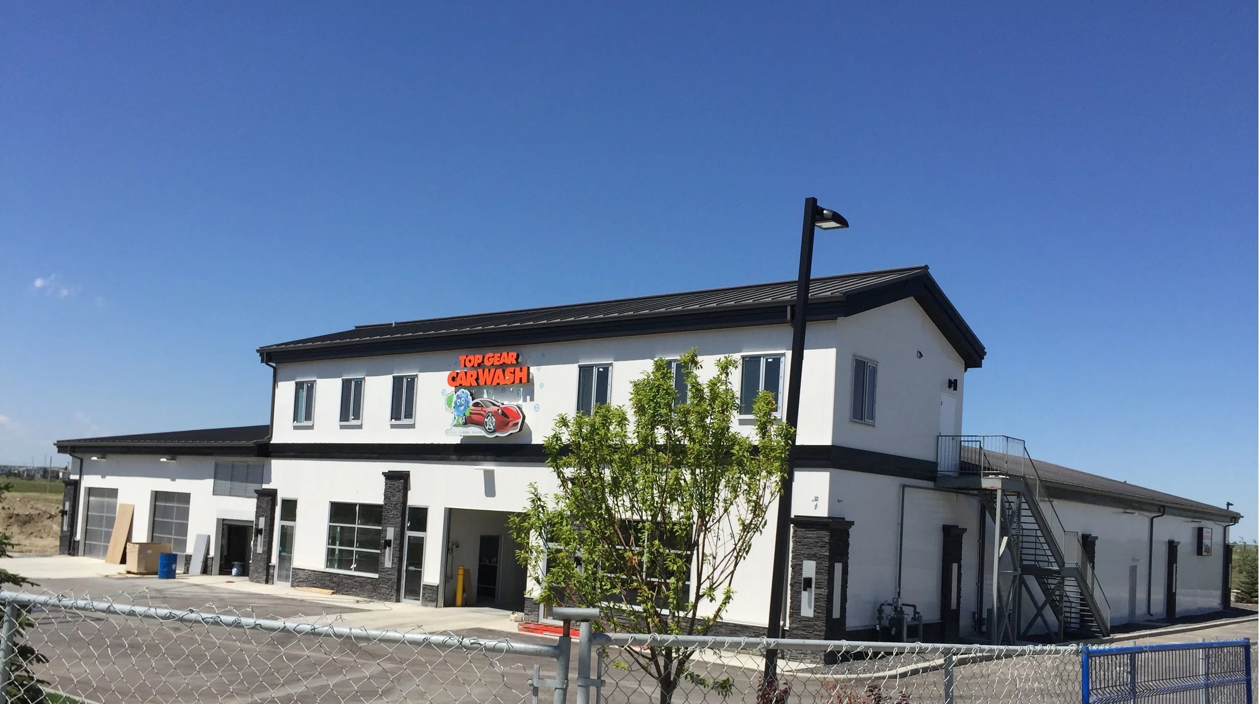 Top Gear Car Wash Located at 120th Ave & 18th Street N.E., Calgary AB. A 13 bays of wand wash and 2 touchless car washes.