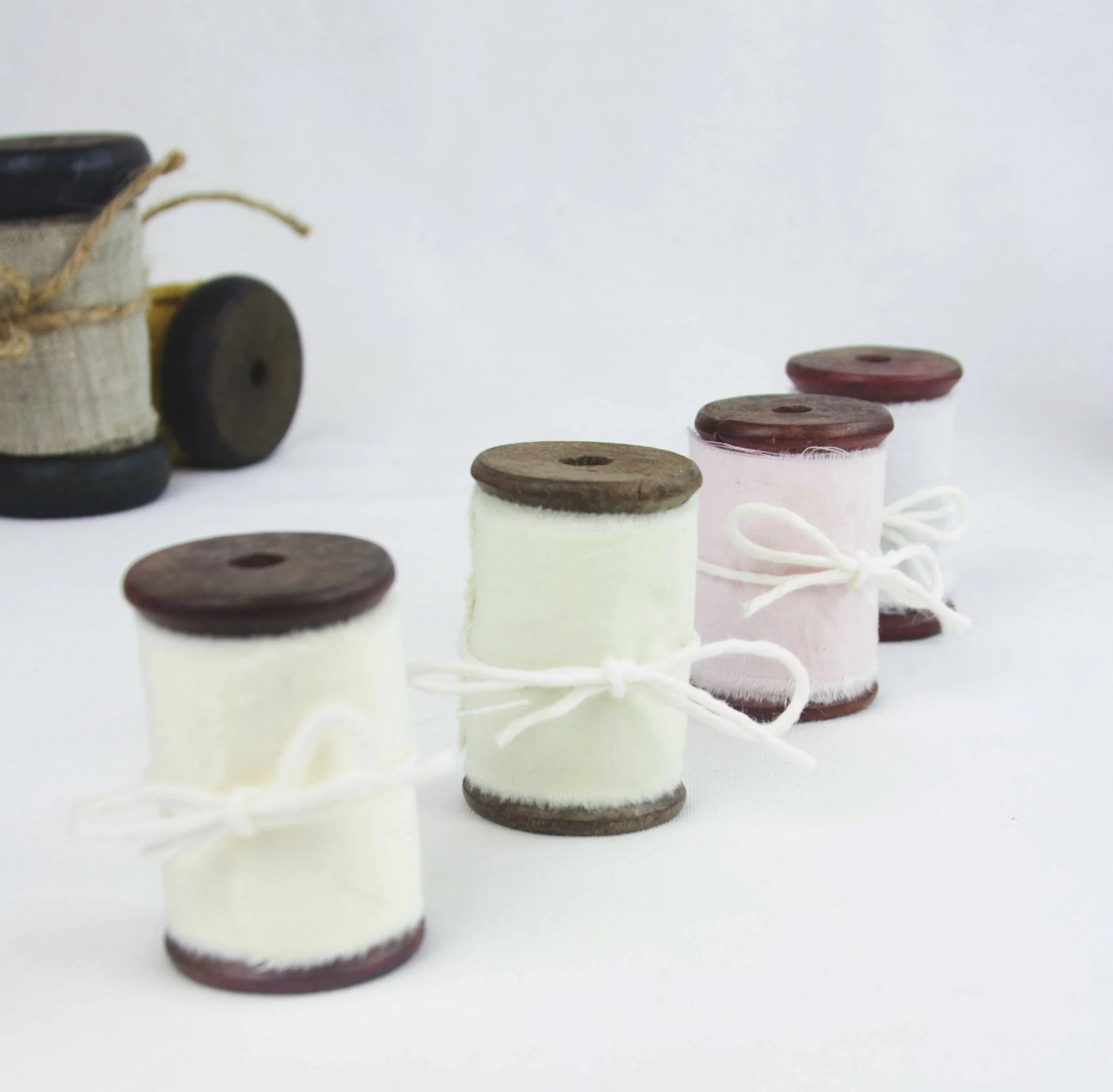 hand dyed cotton ribbon, raw edge, wood spool, photography props