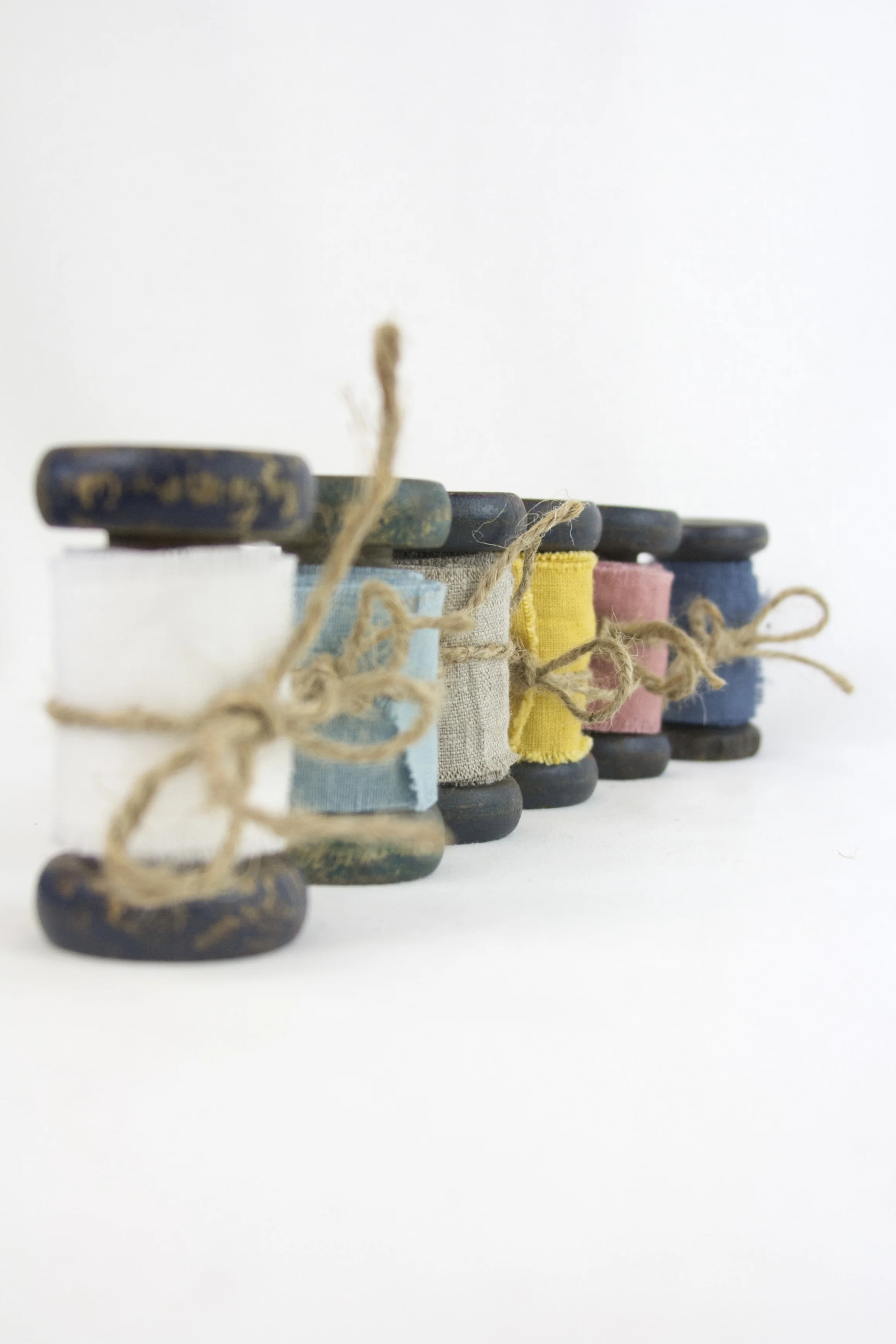 linen ribbon, raw edge, wood spools
