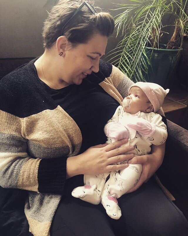 This growing little lady has adoring eyes for student midwife, Christina. Midwives love Christmas Eve baby snuggles! 🌿❄️🌿