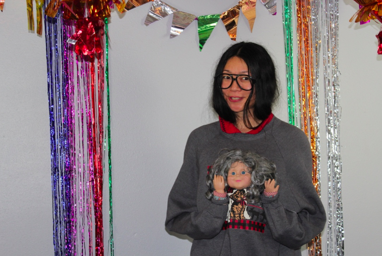 What do you do if you only have an hour to slap together the ugliest sweater for a holiday party? Locate the closest thrift store and grab the first thing that catches your eye. I reached for a dog/cat sweatshirt and a granny toy doll. Little granny was quite polite to everyone and in return received plenty o drinks, kisses and puffs throughout the night. Who knew lil granny could party so hard?