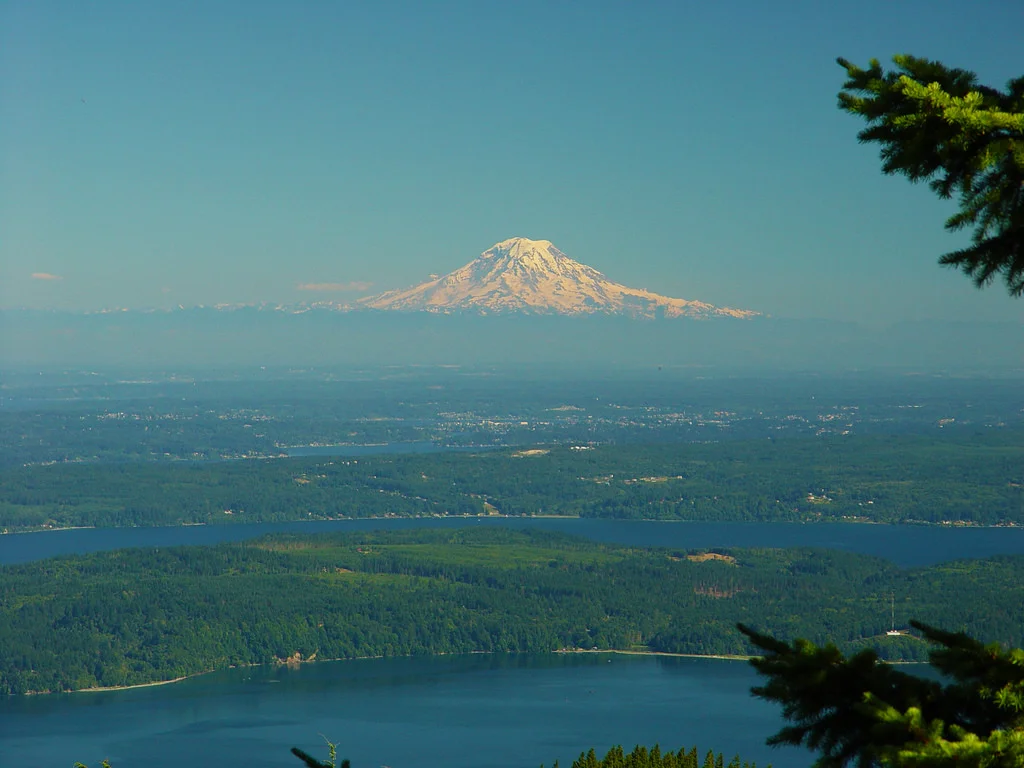 The Mt. Rainier volcano dominates Puget Sound, seen from Mt. Walker. Dabob Bay and Hood Canal in the foreground. Photo: In Wonder Photo