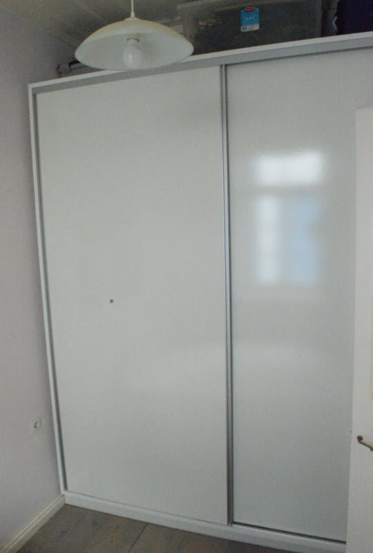 spacious_townhouse_in_the_centre_of_Skopelos_cupboard_spare_bedroom.jpg