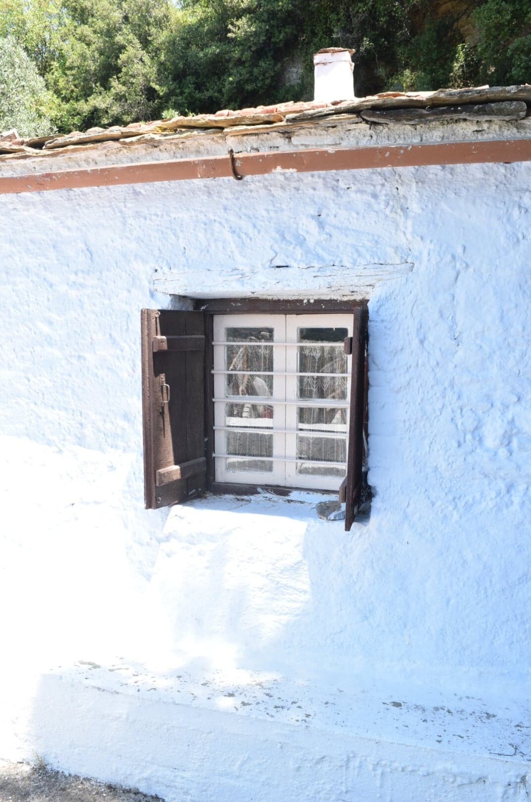 land_with_small_farmhouse_and_small_building_window.jpg