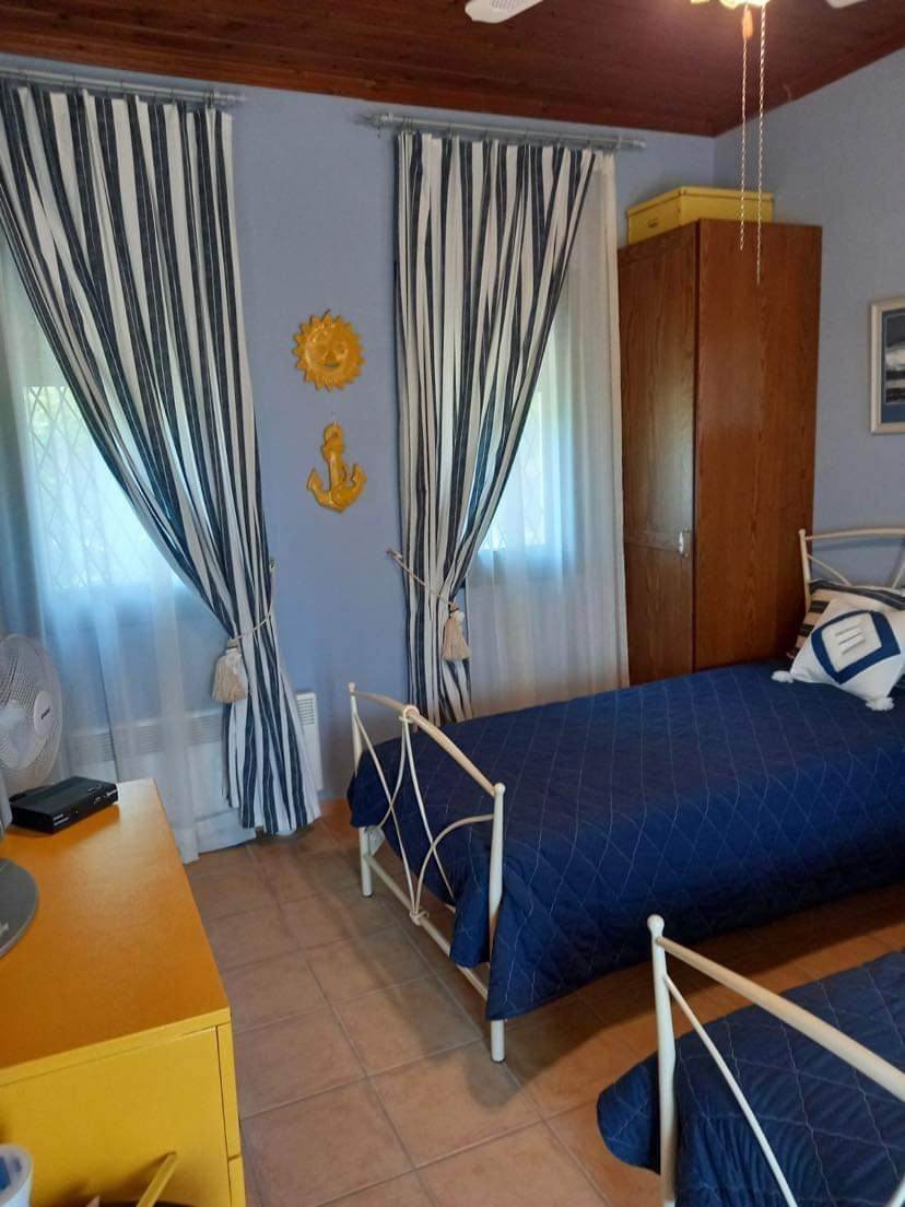 modern_two_bedroom_house_in_Elios_blue_beds.jpg