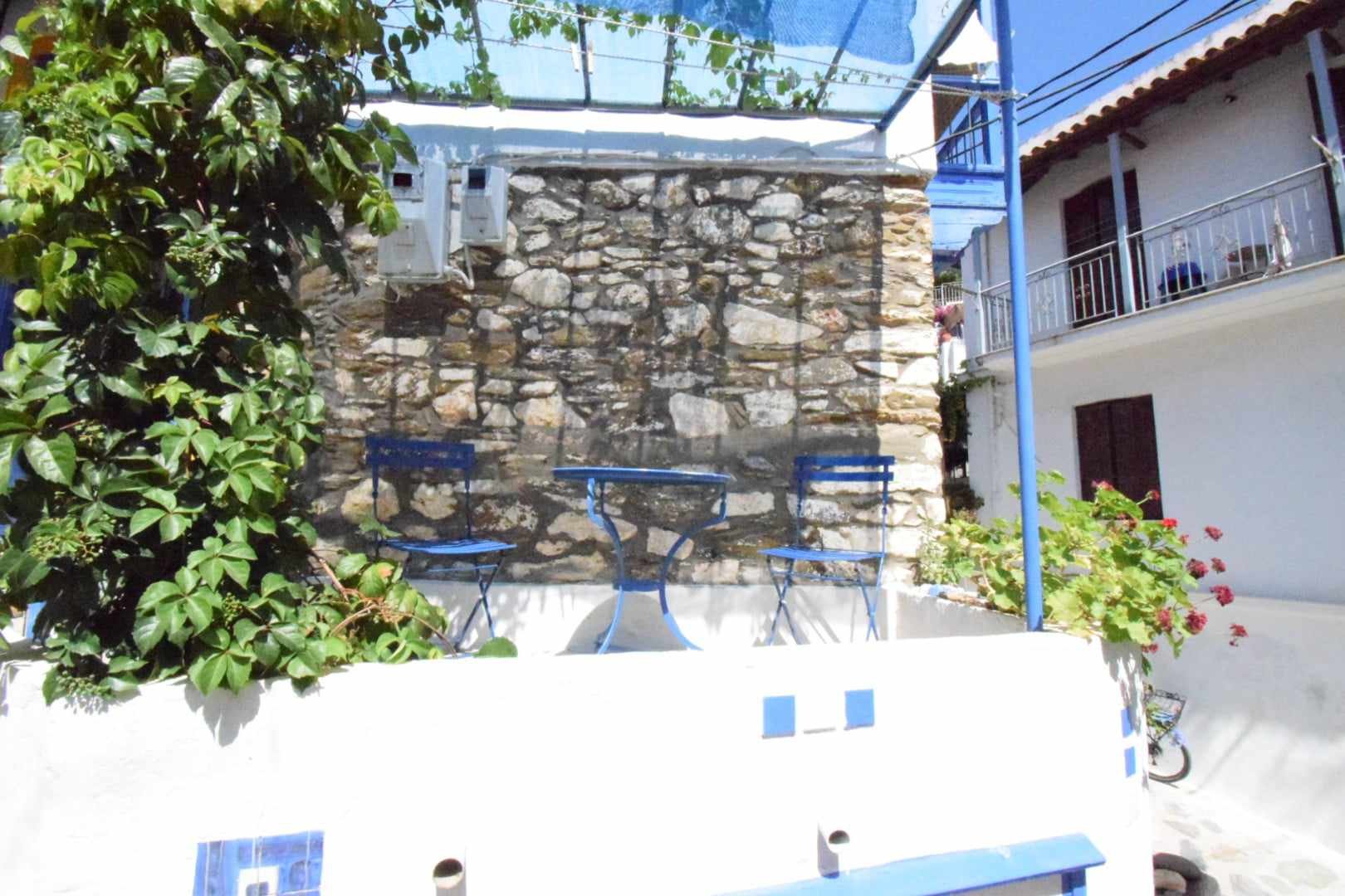 very_charming_townhouse_with_outside_space_chairs_stone_wall.jpg