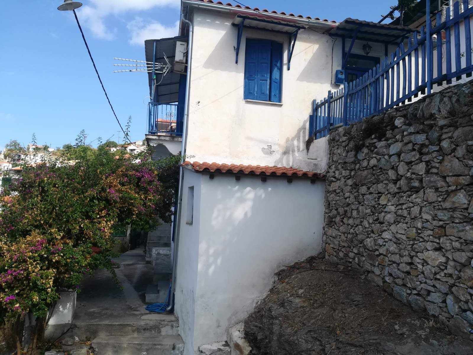 Traditional_house in_Glossa_with_a sea_view_window.jpg