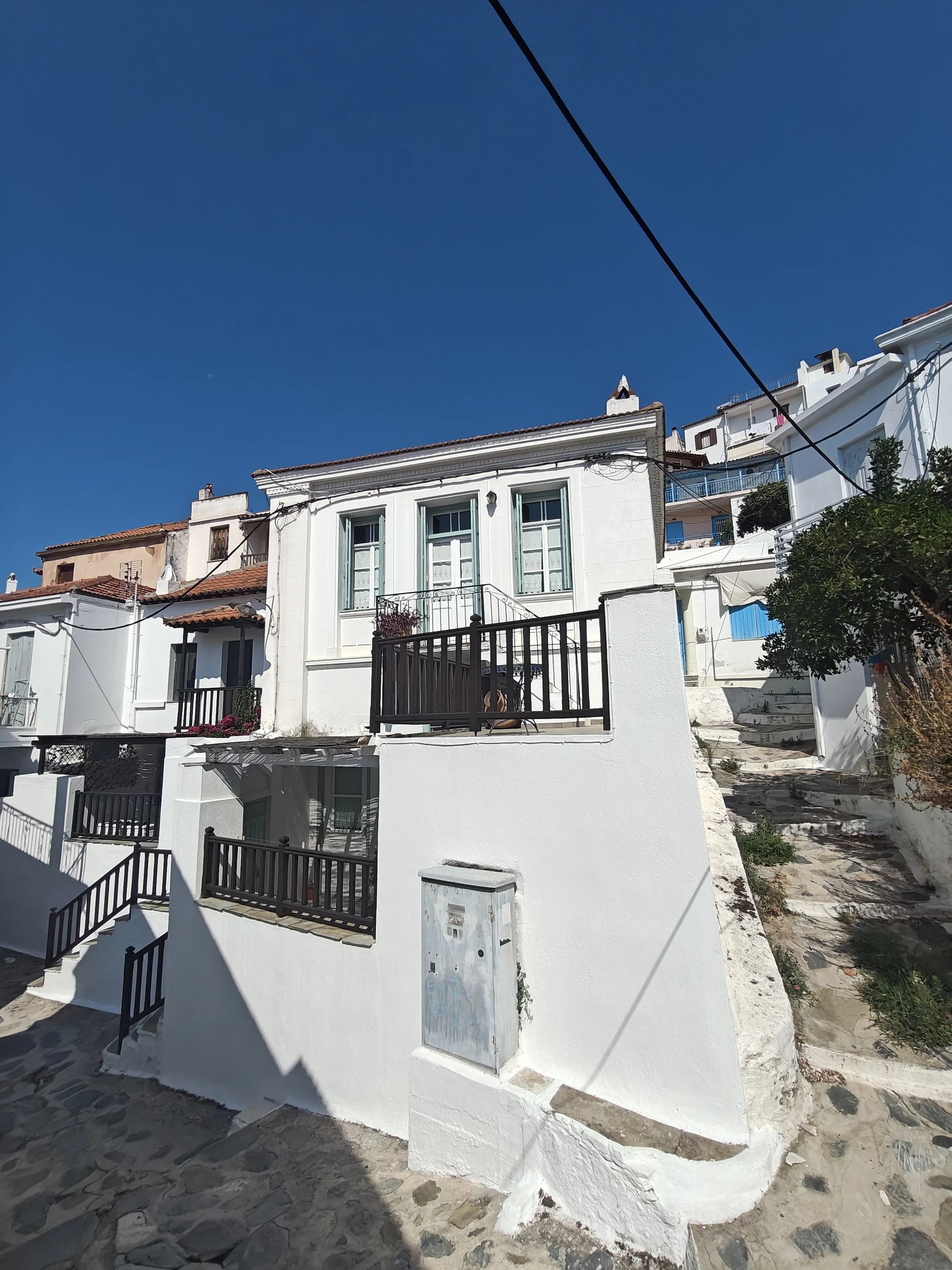 charming_greek_style_house_with_outside_spaces_shutters.jpg