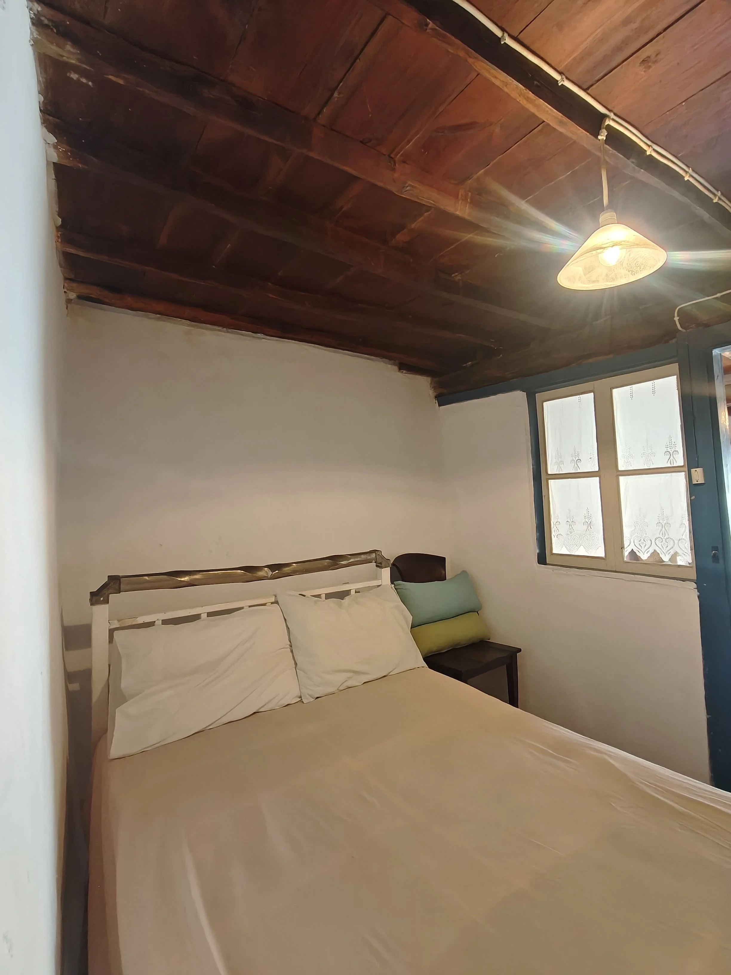 charming_greek_style_house_with_outside_spaces_first_bedroom.jpg