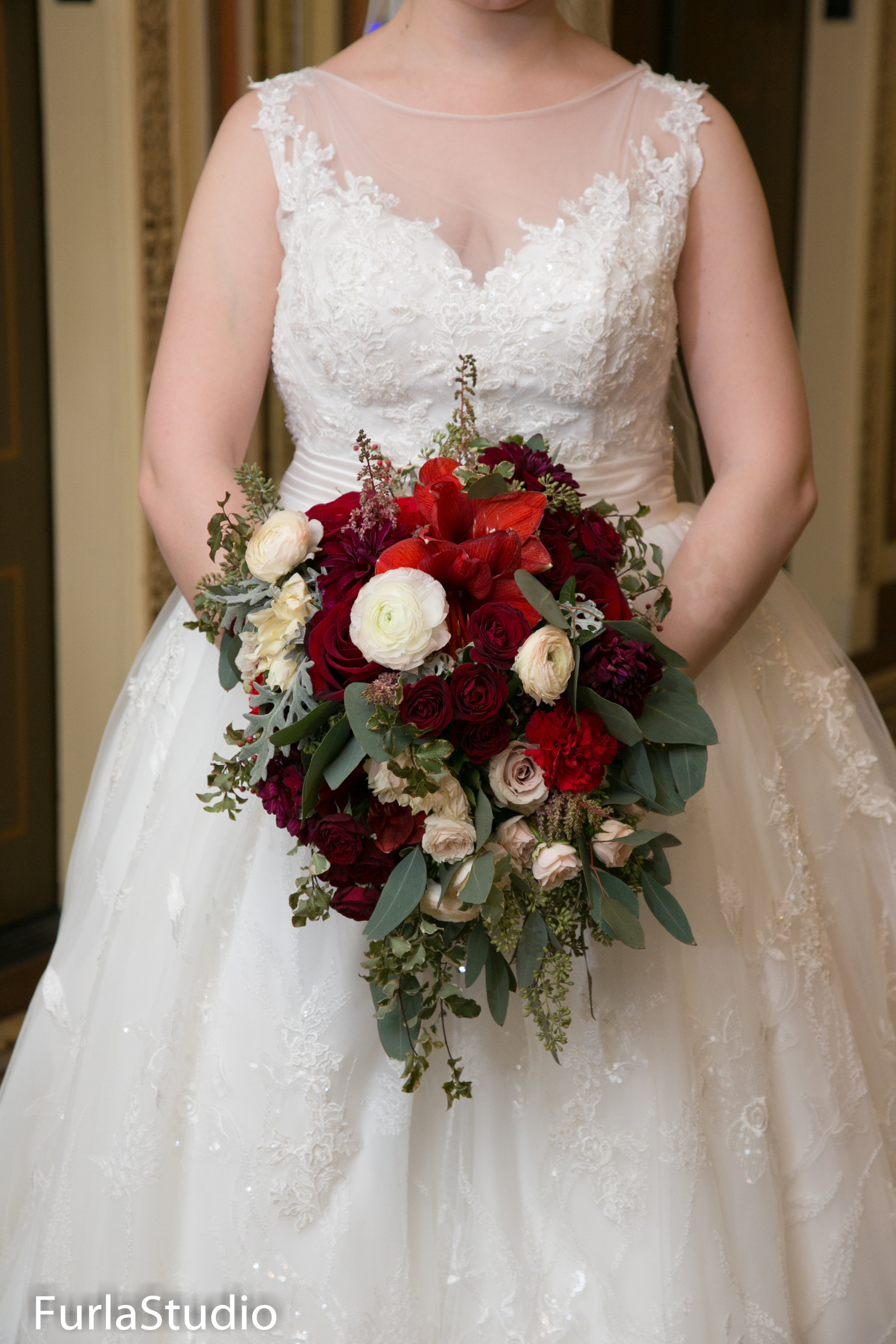  Gorgeous winter wedding bouquet with red, white and burgundy roses. Cascading bouquets are gorgeous in Chicago winter weddings | Your Day by MK | Chicago Wedding Planner | MK Andersen 