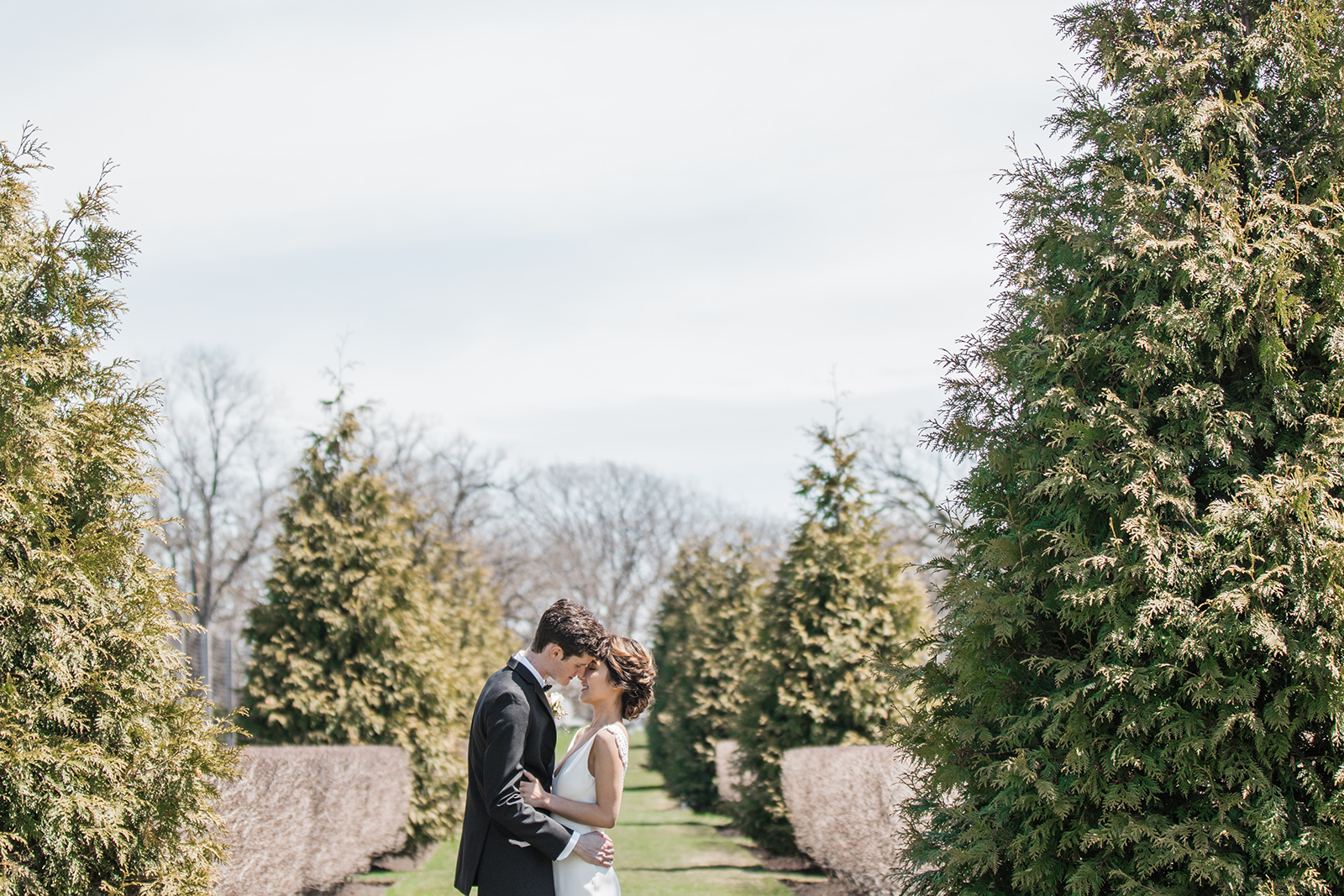 Couple shares a cute moment at Elawa Farm in Chicago for their spring wedding