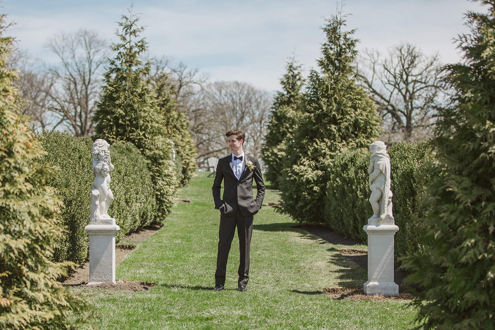  Groom in a slim black Tuxedo from Formally Modern Tuxedo at Elawa Farm in Lake Forest for a Chicago Spring Wedding 