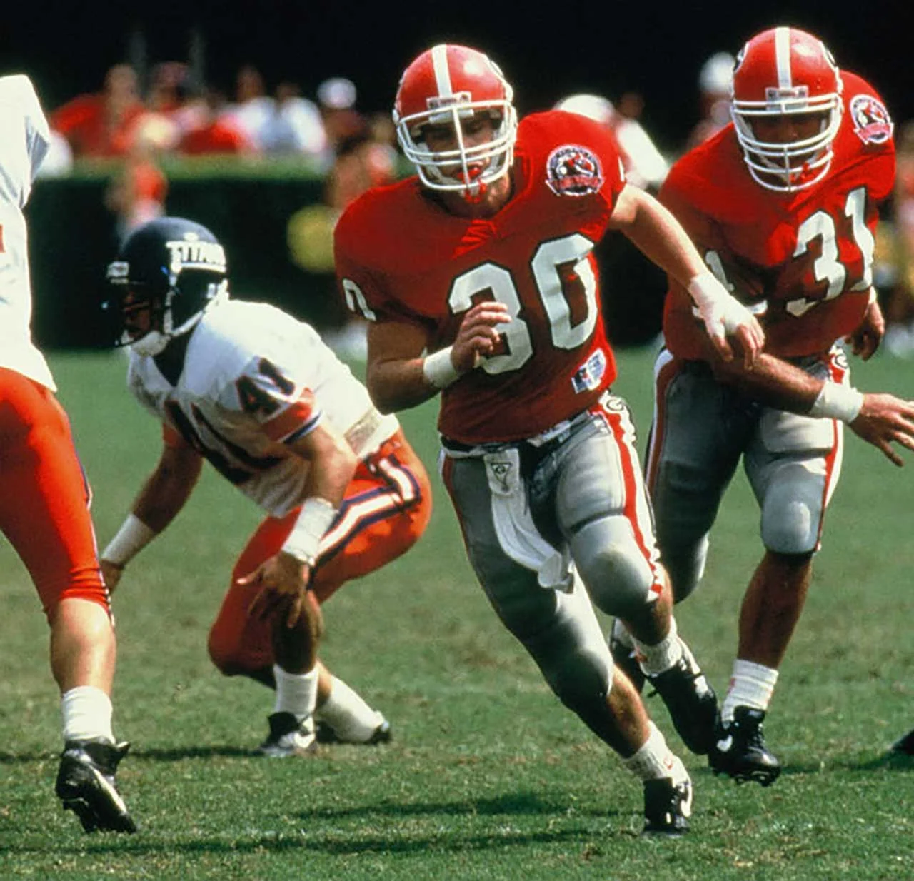 Will Muschamp (30) rushing the passer vs Cal State Fullerton in 1992 - via UGA Athletics