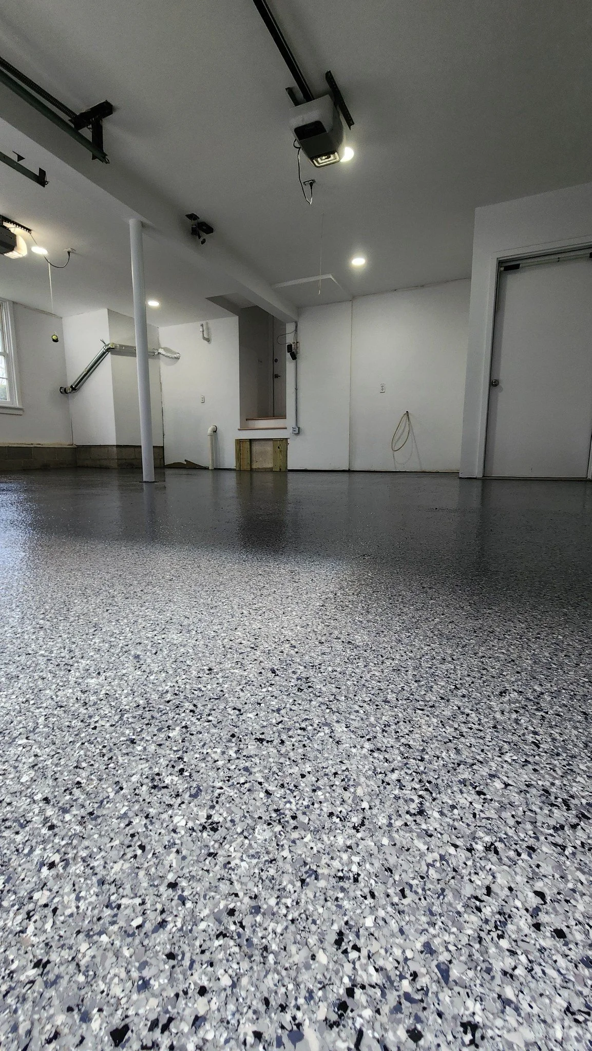 Glossy flake epoxy garage floor, low-angle view, Weston, CT