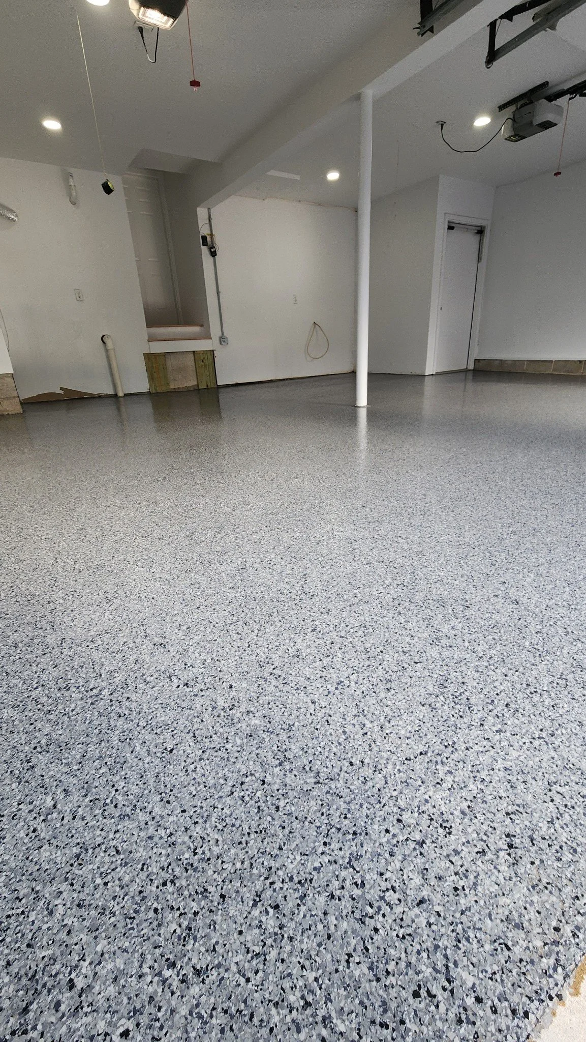 Finished flake epoxy garage floor near garage window, Weston, CT