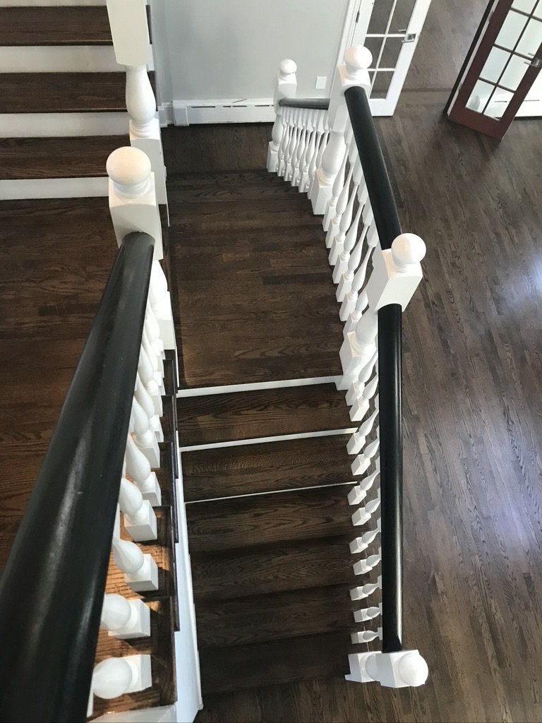 Refinished staircase with dark-stained oak treads seen from above, Fairfield, CT