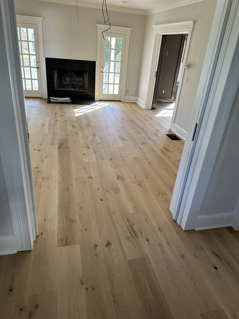 wide plank character wood installation near fireplace in fairfield ct