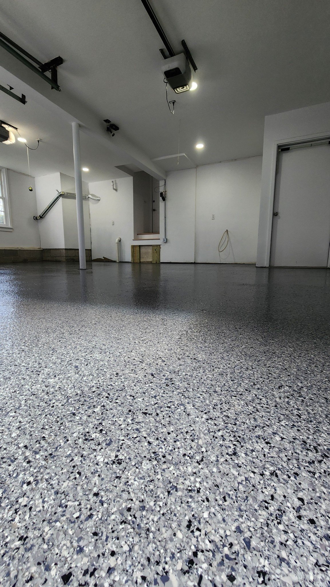 Finished grey epoxy garage floor with dark blue, black, and white flakes, Weston, CT