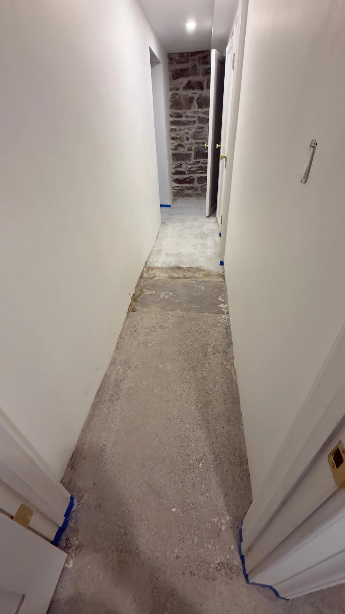 Bare concrete basement corridor before epoxy flake coating, Danbury, CT