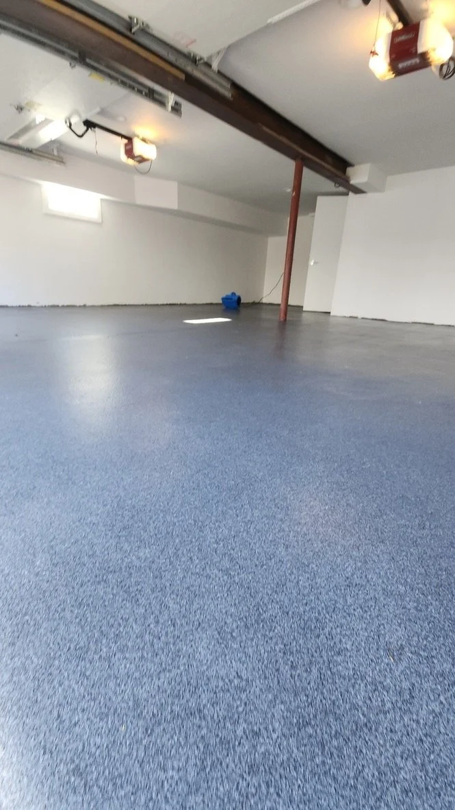 Finished grey and blue epoxy flake garage floor with red support beam, Trumbull, CT garage flooring