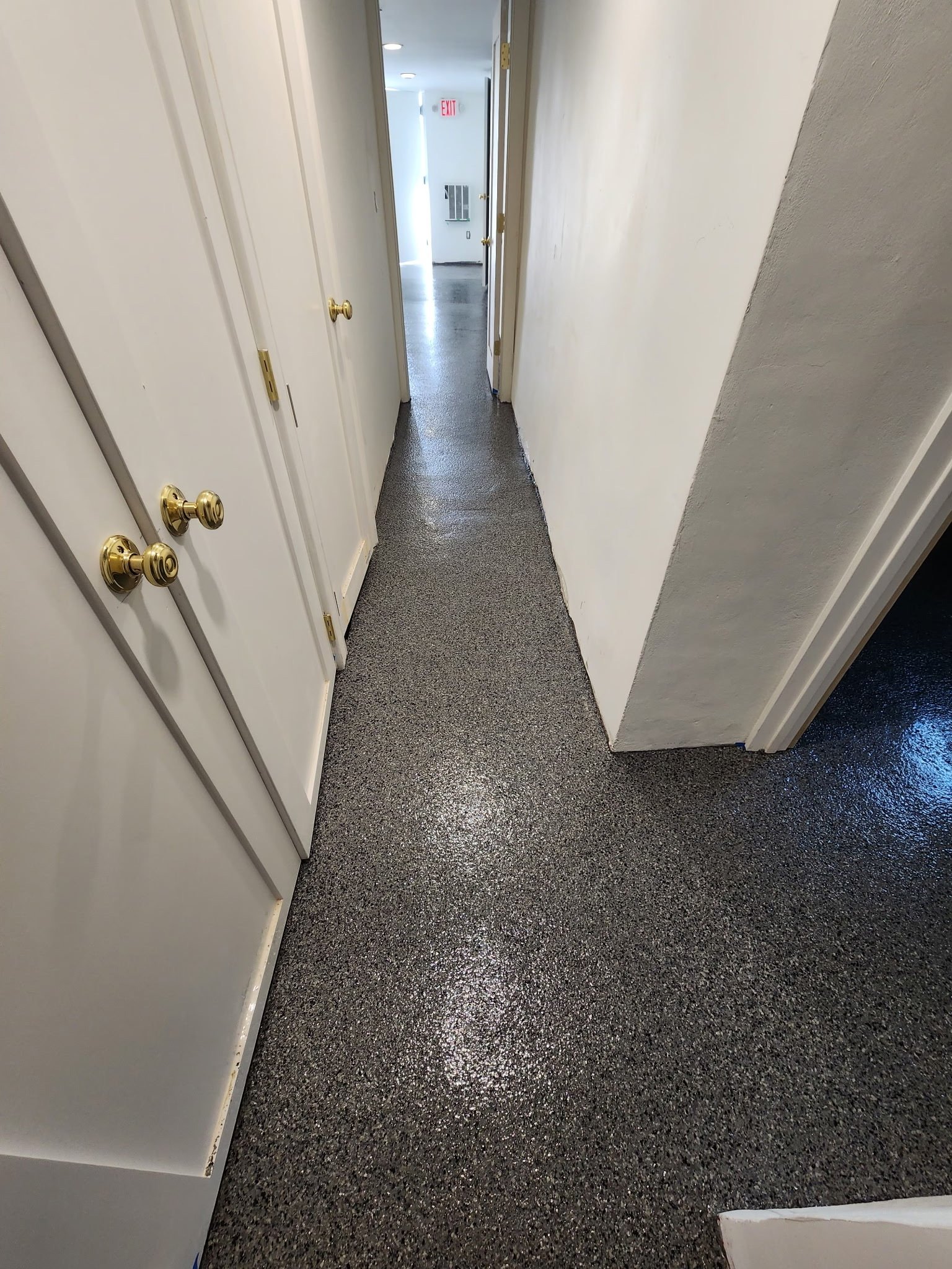 Finished gray, black, and white flake epoxy basement corridor, Danbury, CT