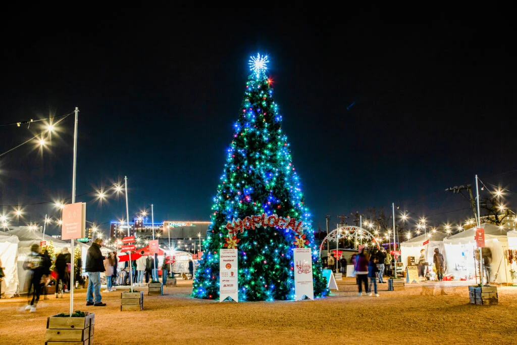 Customers shopping at night time at the Holiday Pop-Ups