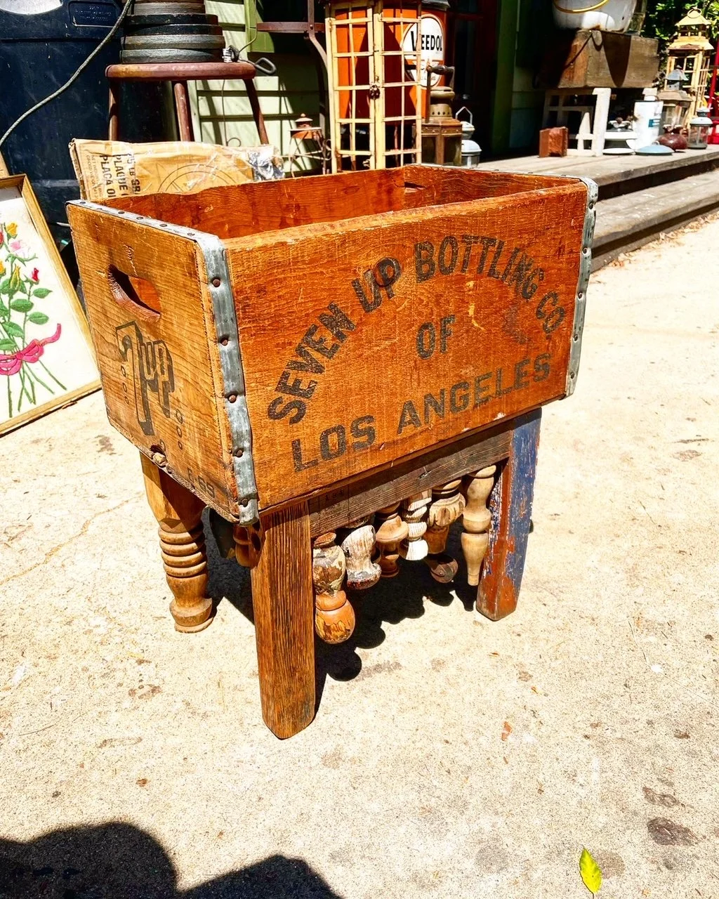 second soda crate with tabl and chair legs.JPG