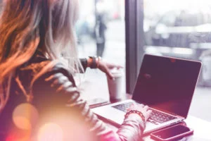 young-freelance-woman-working-remotely-from-cafe-picjumbo-com-300x200.jpg