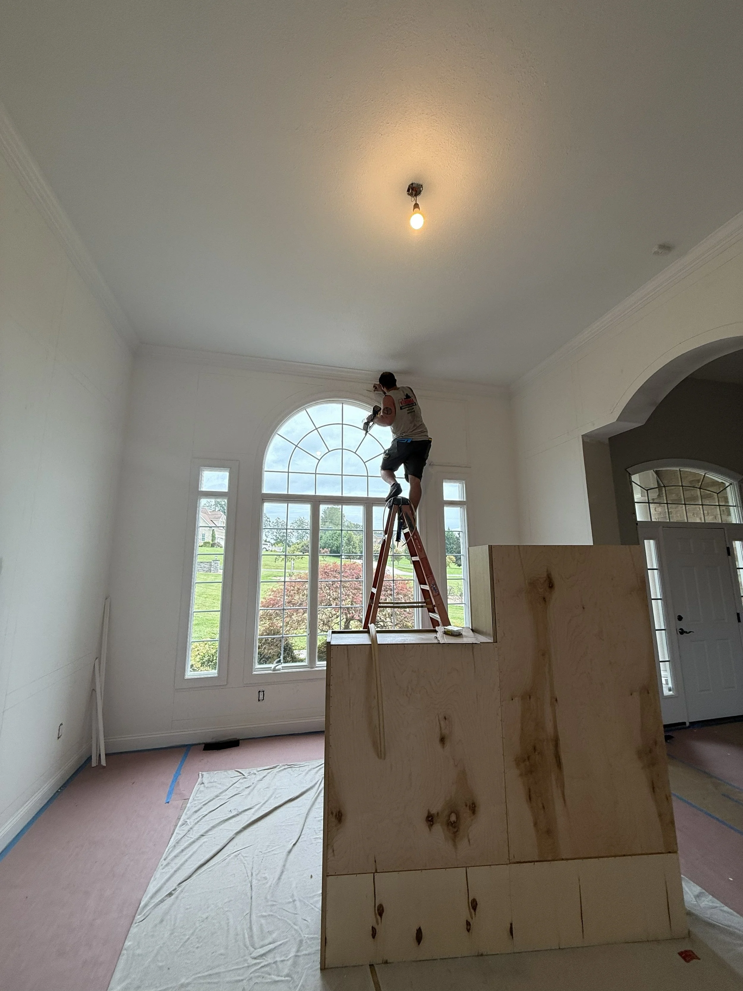 Installing wainscoting in dining room of full home remodel