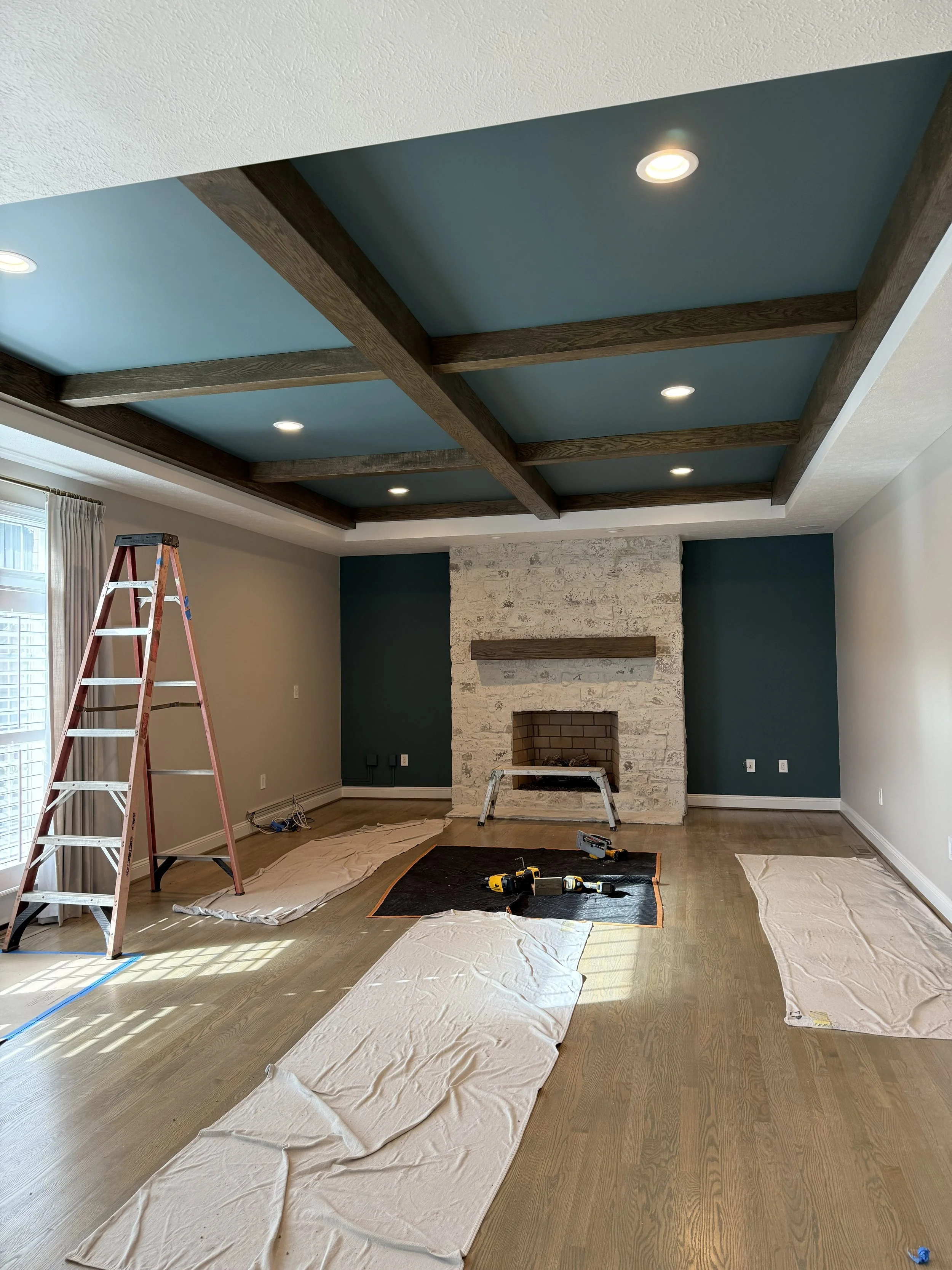 Installed red oak beams in coffered ceiling