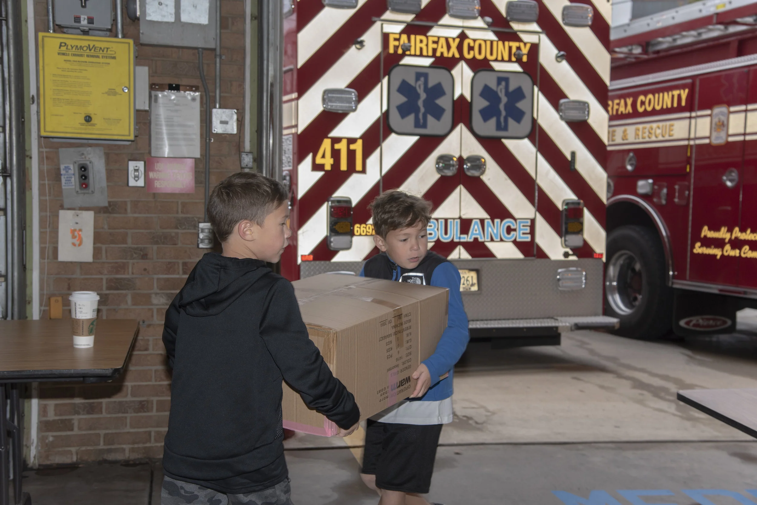 (Left to Right) Madden and Maks working together at the Coat Drive Oct. 2018