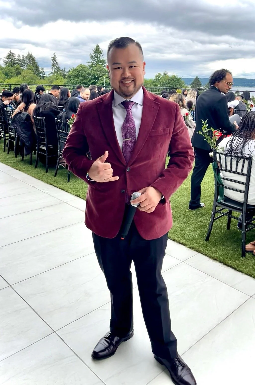 Luxury wedding emcee hosting a high-end Pacific Northwest wedding celebration
