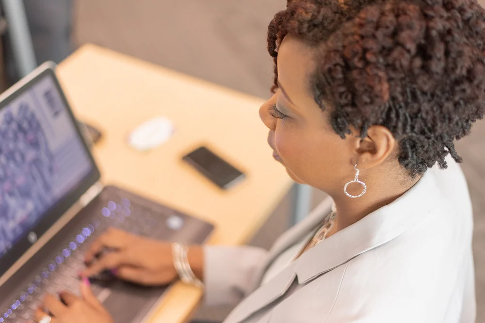 Chianti Richland Co Library typing on laptop