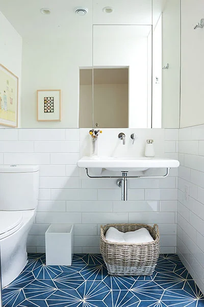 Small-Space-Solutions-for-bathroom-basket-of-white-towels-for-storage.jpg